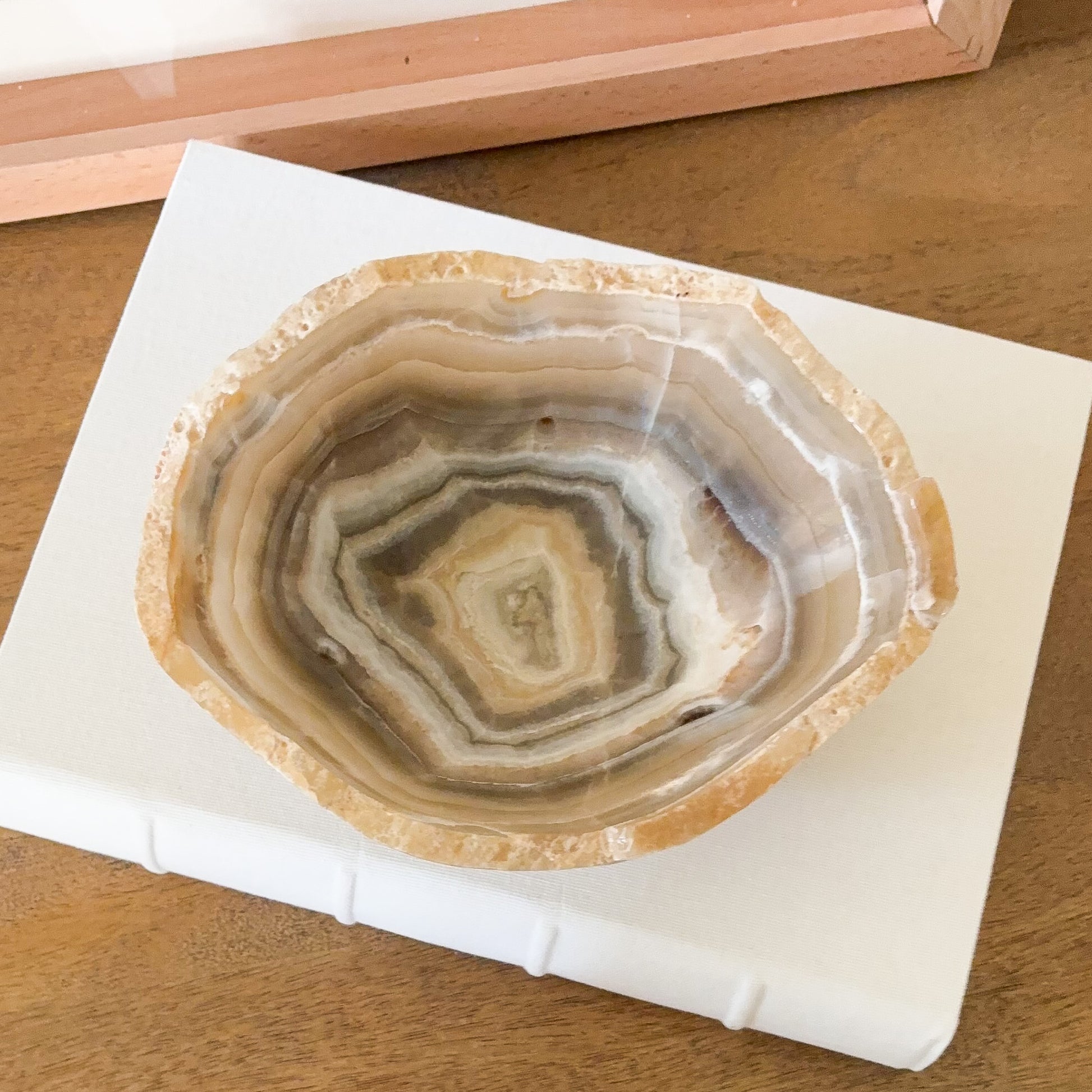 Small hand carved amber onyx bowl, natural banded stone dish in warm beige and golden hues for jewelry or decorative display