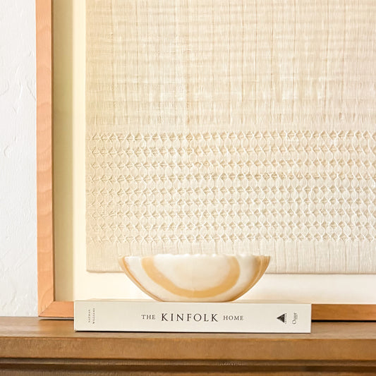 Small hand-carved amber onyx bowl with natural stone patterns, decorative gemstone dish