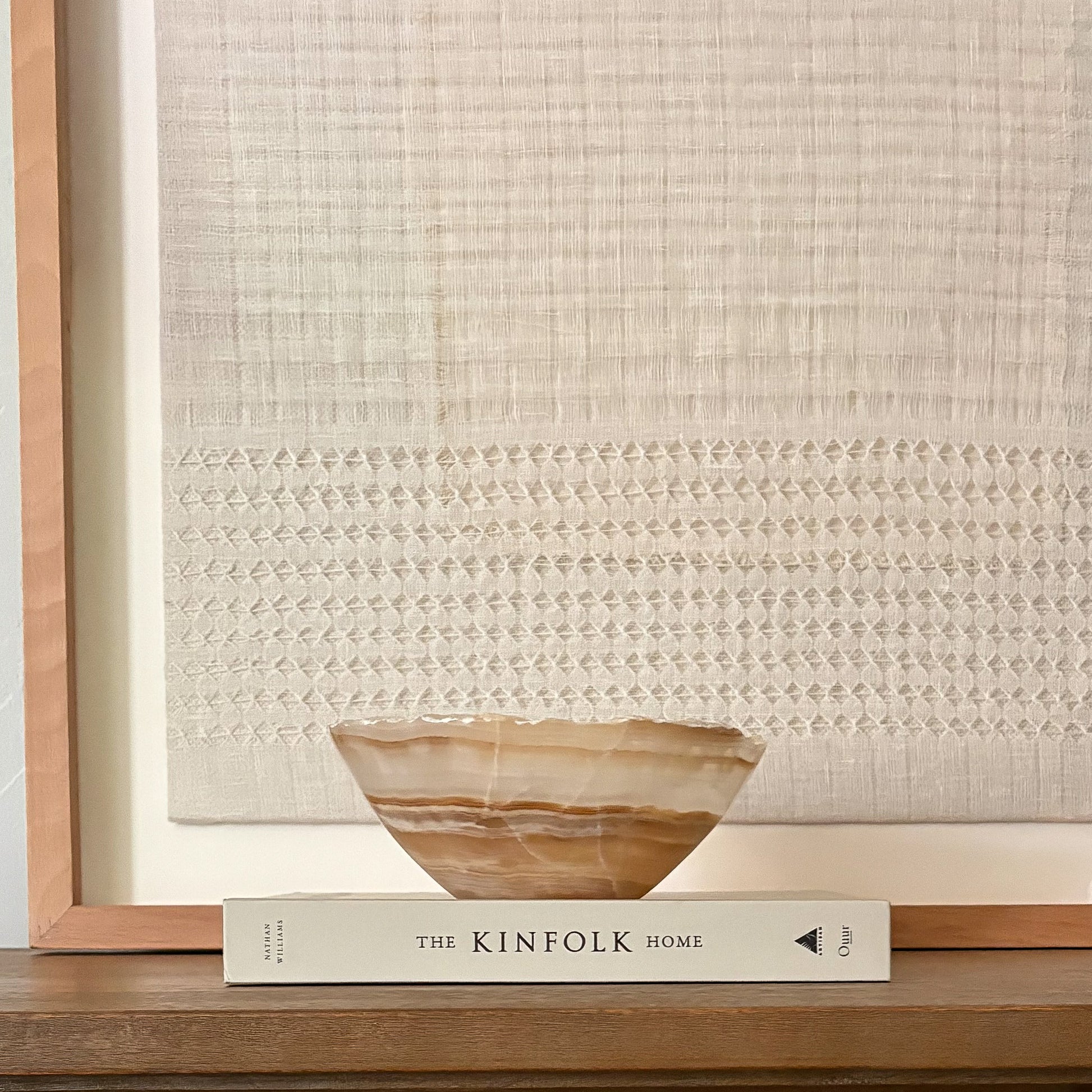 Elegant hand-carved onyx bowl in warm amber tones