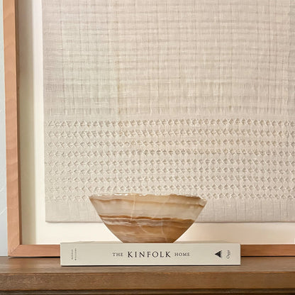 Elegant hand-carved onyx bowl in warm amber tones