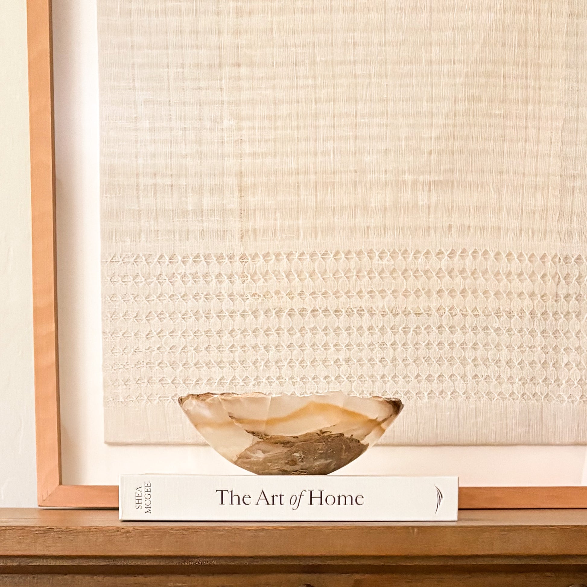 Small hand-carved amber onyx bowl with natural stone veining and polished finish