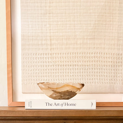 Small hand-carved amber onyx bowl with natural stone veining and polished finish