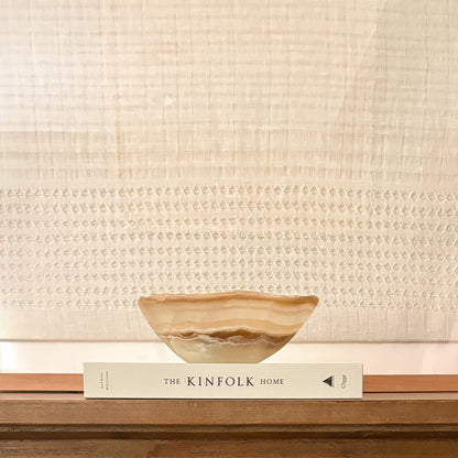 Small amber onyx bowl handcrafted from polished natural stone