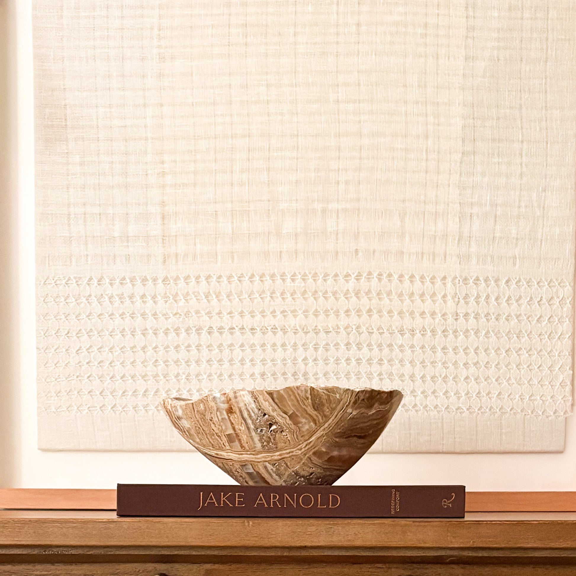 Natural amber onyx decorative bowl with warm golden veining and hand-carved finish