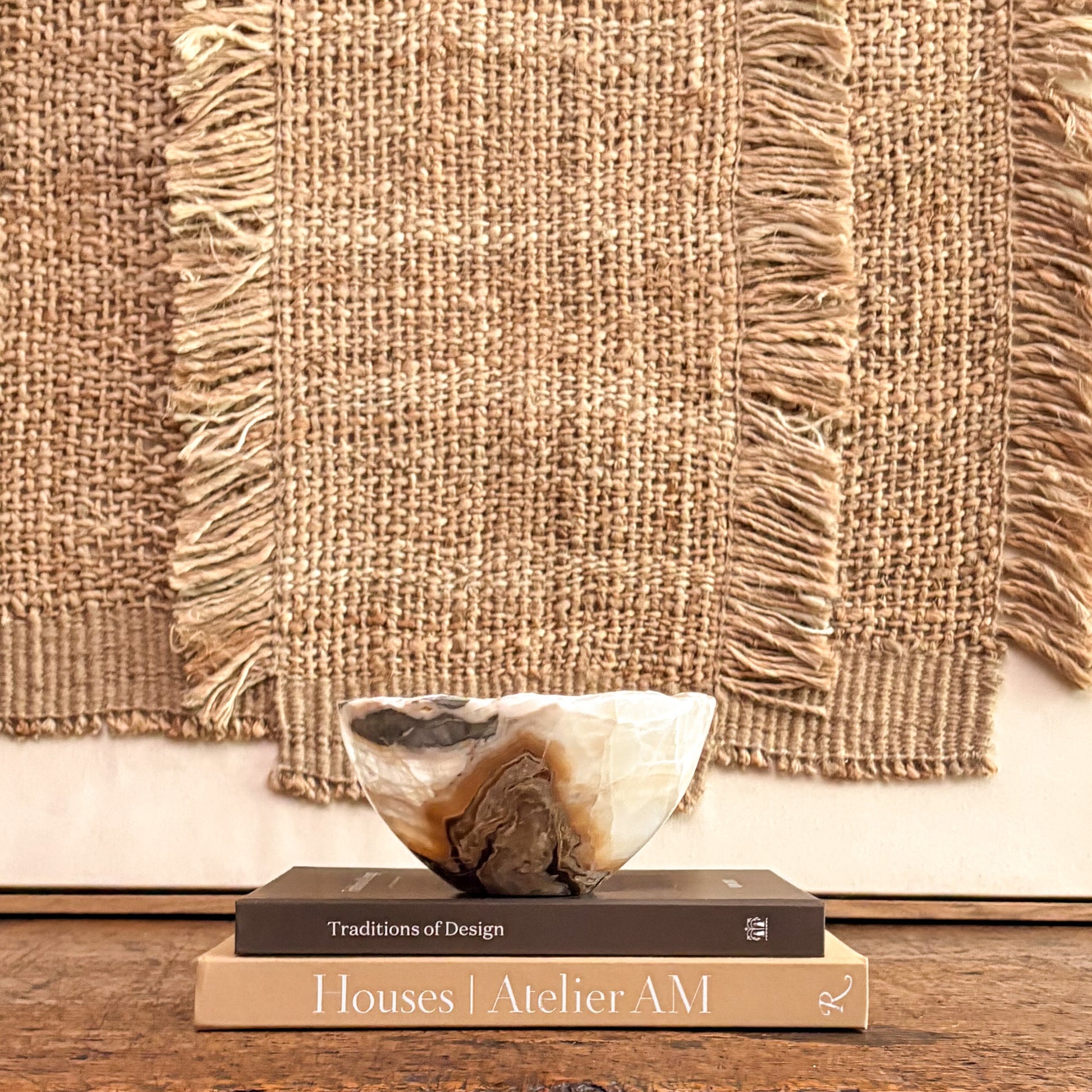 Luxury amber onyx bowl hand carved from natural stone for modern organic home styling.