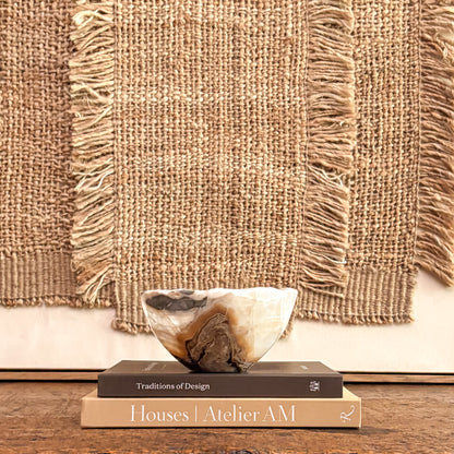 Luxury amber onyx bowl hand carved from natural stone for modern organic home styling.