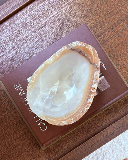 Hand-carved onyx bowl with amber tones