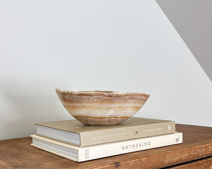 Small hand-carved amber onyx bowl with natural golden honey and cream veining