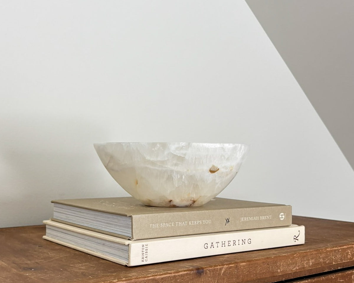 Hand-carved amber onyx catchall bowl in warm golden and caramel tones
