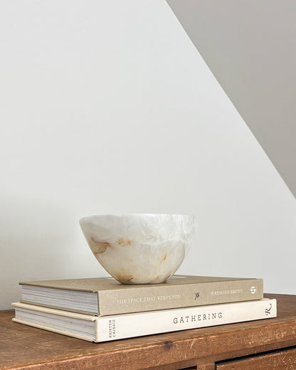 Small amber onyx stone bowl with natural translucent layers and unique veining