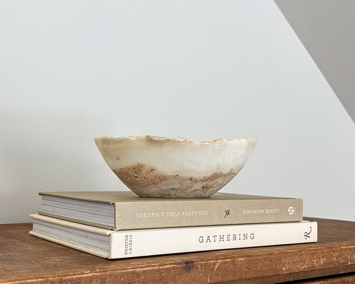 Small hand-carved amber onyx bowl with natural golden honey and cream veining