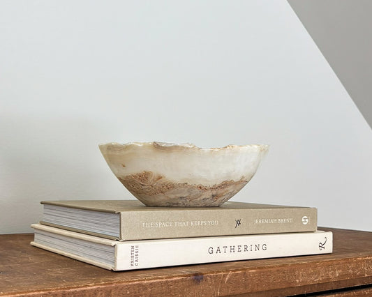 Small hand-carved amber onyx bowl with natural golden honey and cream veining