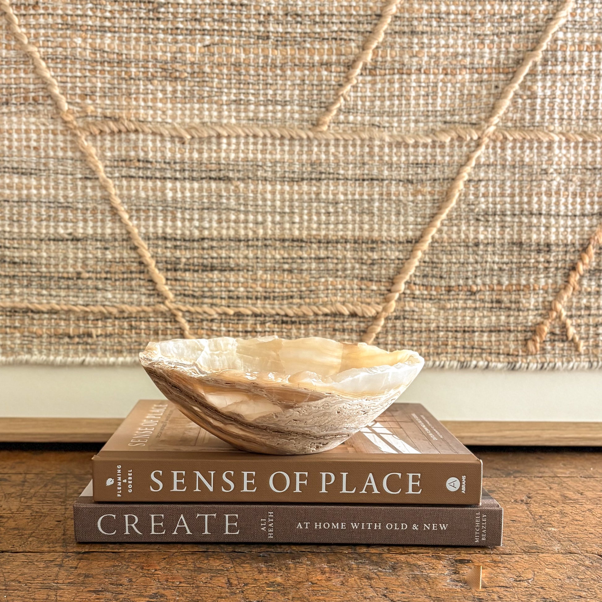 Handmade amber onyx bowl on tabletop, warm golden glow