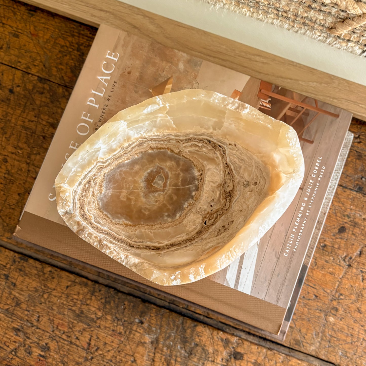 Amber onyx bowl viewed from above, smooth interior with swirling veins