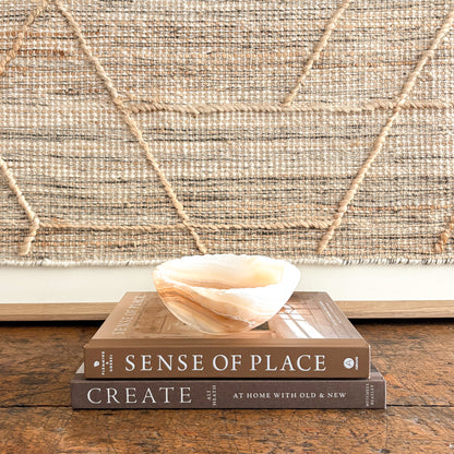 Translucent amber onyx bowl, carved and polished from natural stone