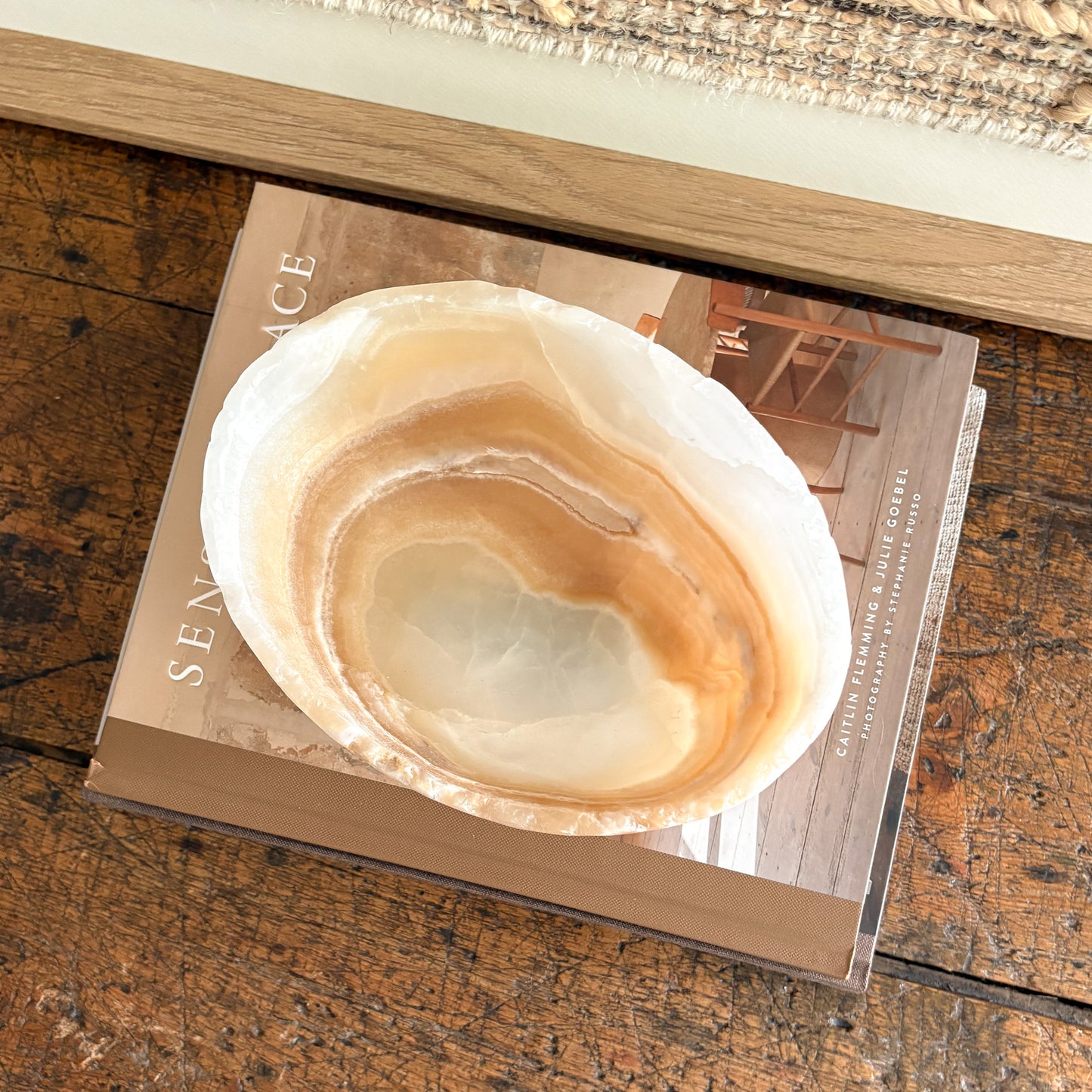 Close-up of amber onyx bowl showing honey and cream marbling