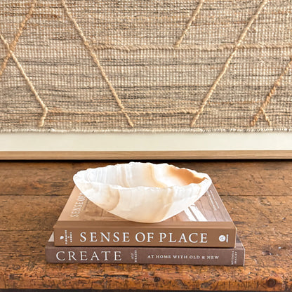 Amber onyx bowl carved by hand, translucent stone with natural striations