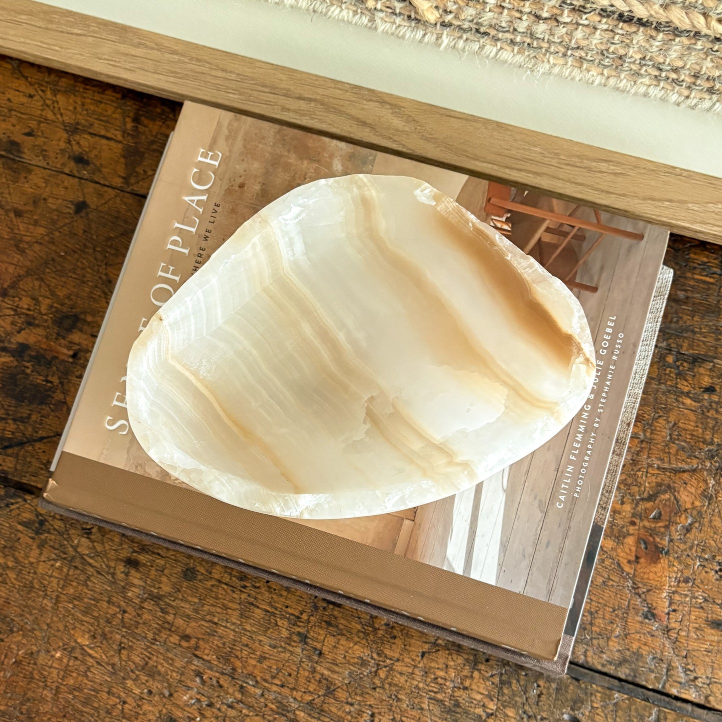 Amber onyx bowl viewed from above, smooth interior with swirling veins