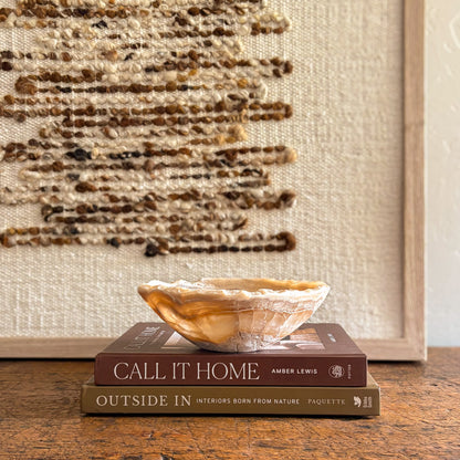 Translucent amber onyx bowl, carved and polished from natural stone