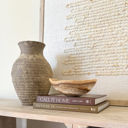 Hand carved amber onyx bowl used as minimalist home decor accent
