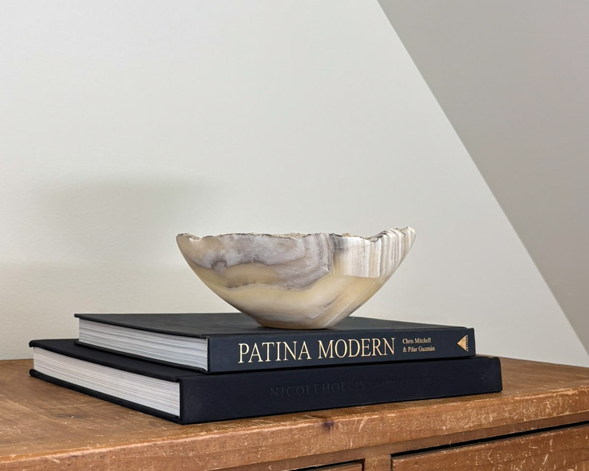 Hand-carved grey onyx bowl with natural stone veining and organic patterns