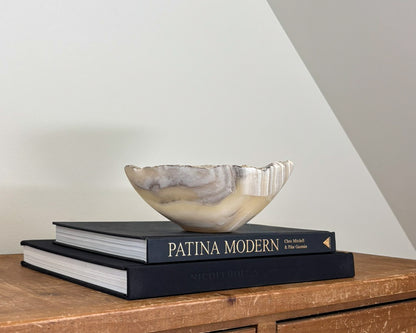 Hand-carved grey onyx bowl with natural stone veining and organic patterns