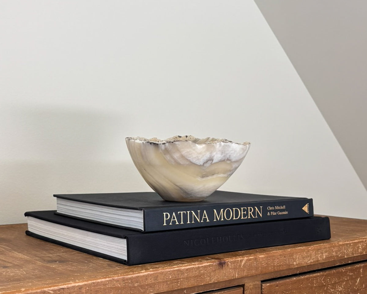 Polished grey onyx bowl featuring unique mineral patterns and tonal variations