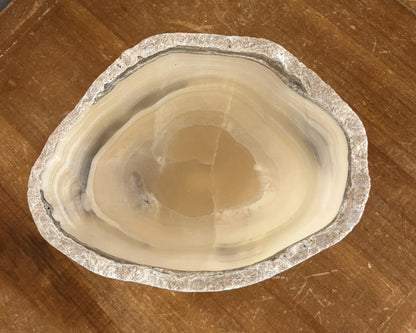 Polished grey onyx bowl featuring unique mineral patterns and tonal variations