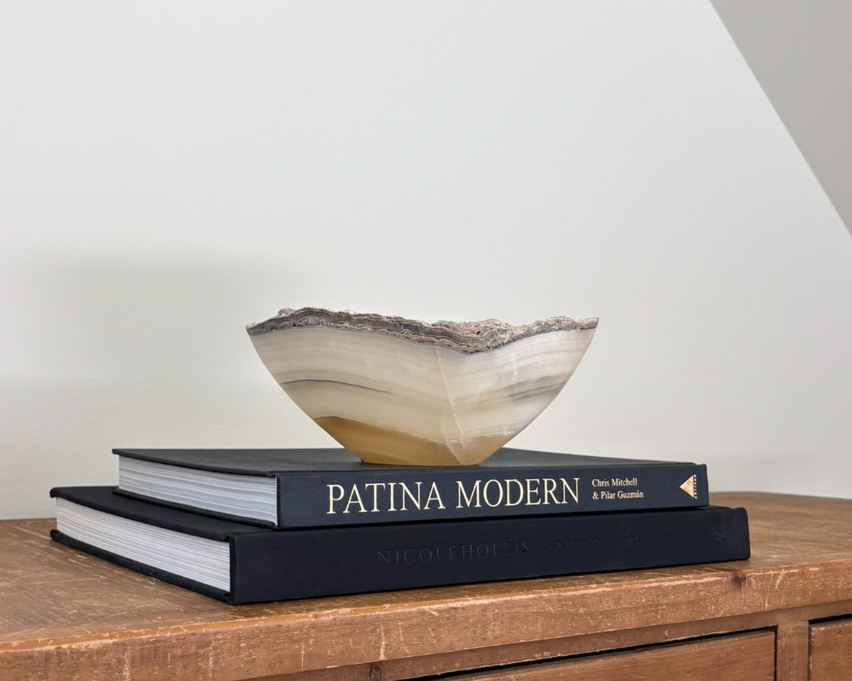 Hand-carved grey onyx bowl with natural stone veining and organic patterns