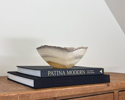 Hand-carved grey onyx bowl with natural stone veining and organic patterns