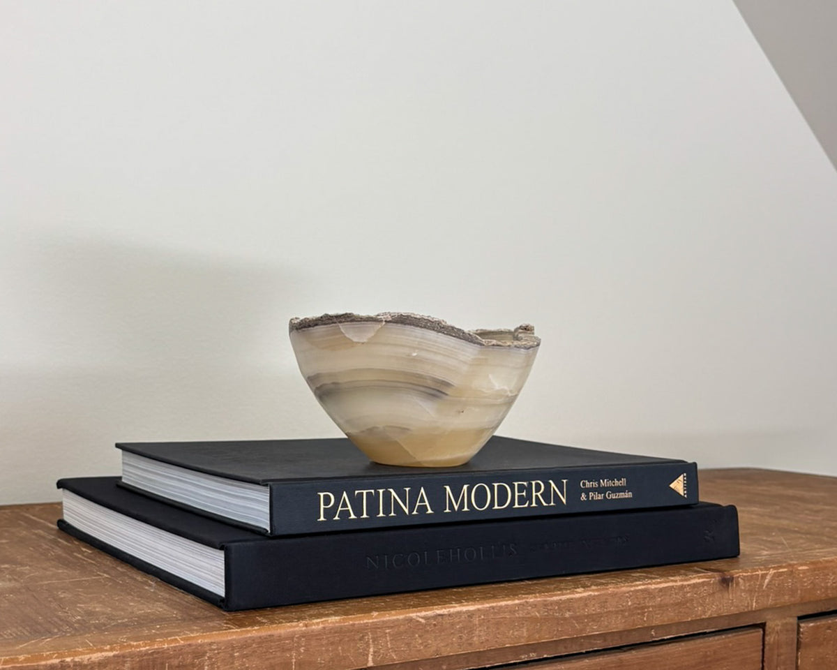 Polished grey onyx bowl featuring unique mineral patterns and tonal variations