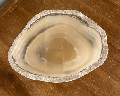 Artisan-carved grey onyx bowl with distinctive natural banding