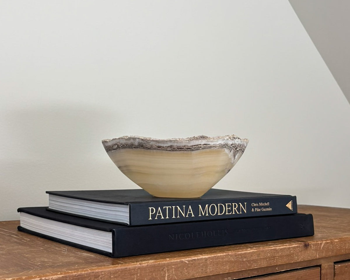 Hand-carved grey onyx bowl with natural stone veining and organic patterns