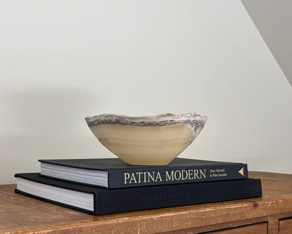 Hand-carved grey onyx bowl with natural stone veining and organic patterns