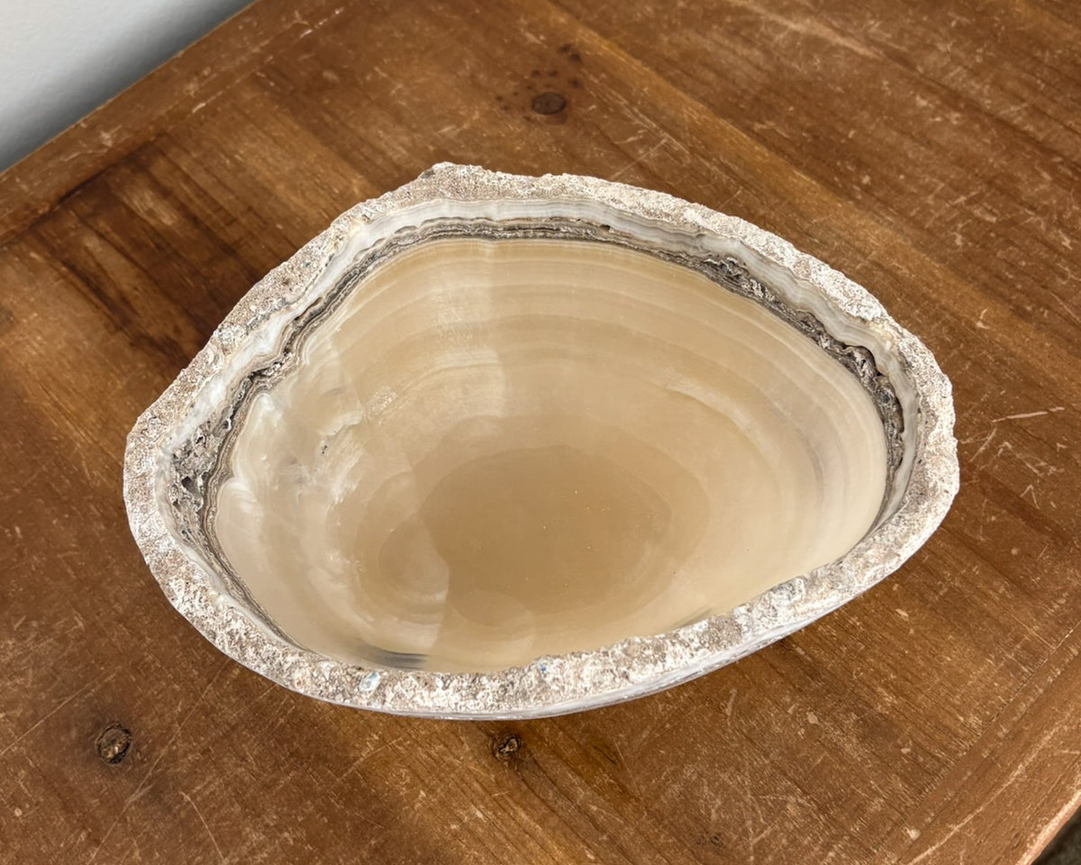 Polished grey onyx bowl featuring unique mineral patterns and tonal variations