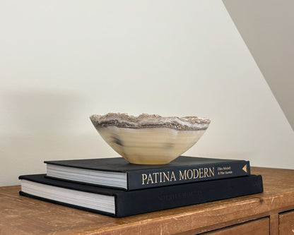 Artisan-carved grey onyx bowl with distinctive natural banding
