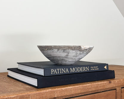 Hand-carved grey onyx bowl with natural stone veining and organic patterns