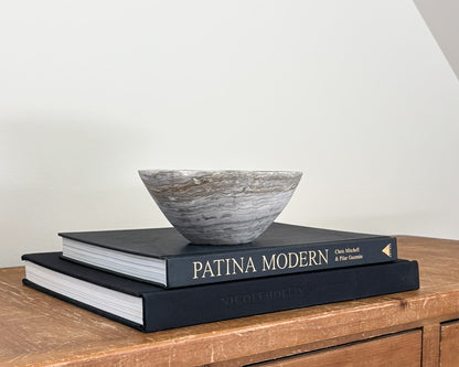 Polished grey onyx bowl featuring unique mineral patterns and tonal variations