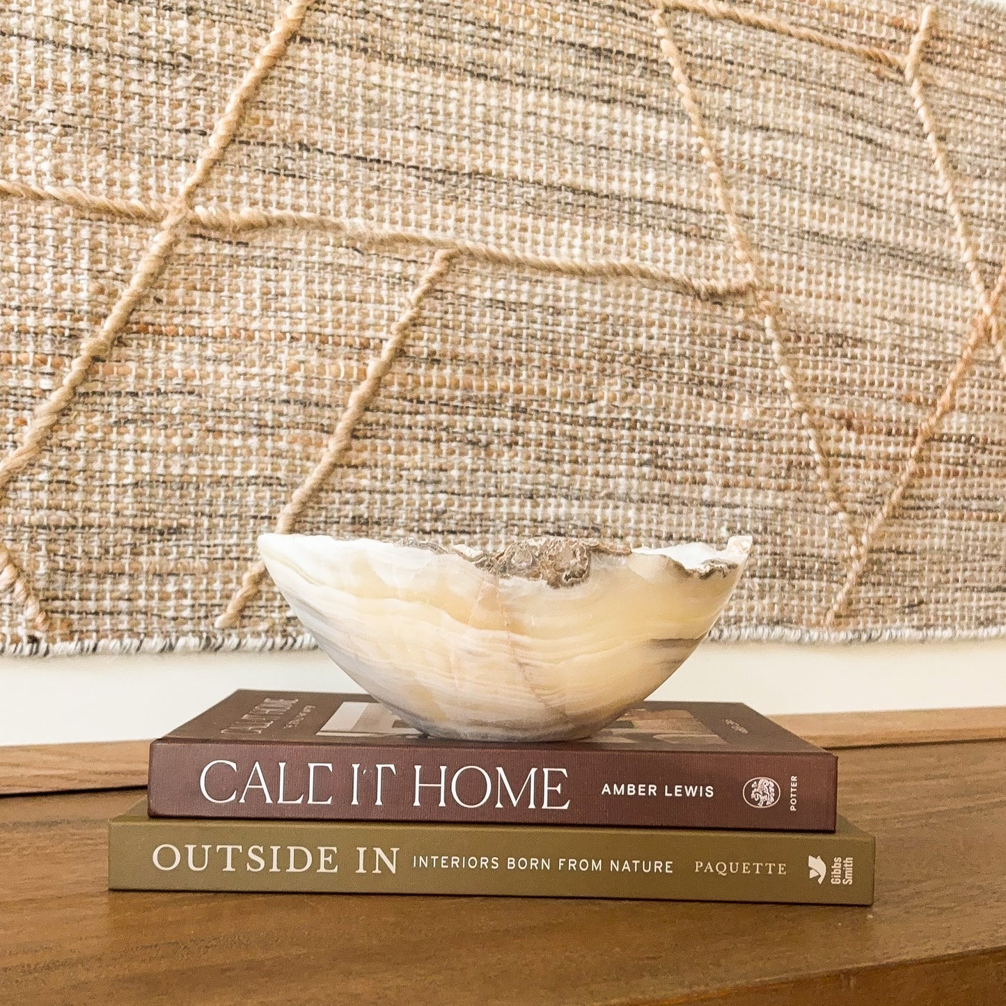 Small hand carved amber onyx bowl with natural stone veining, polished decorative gemstone dish