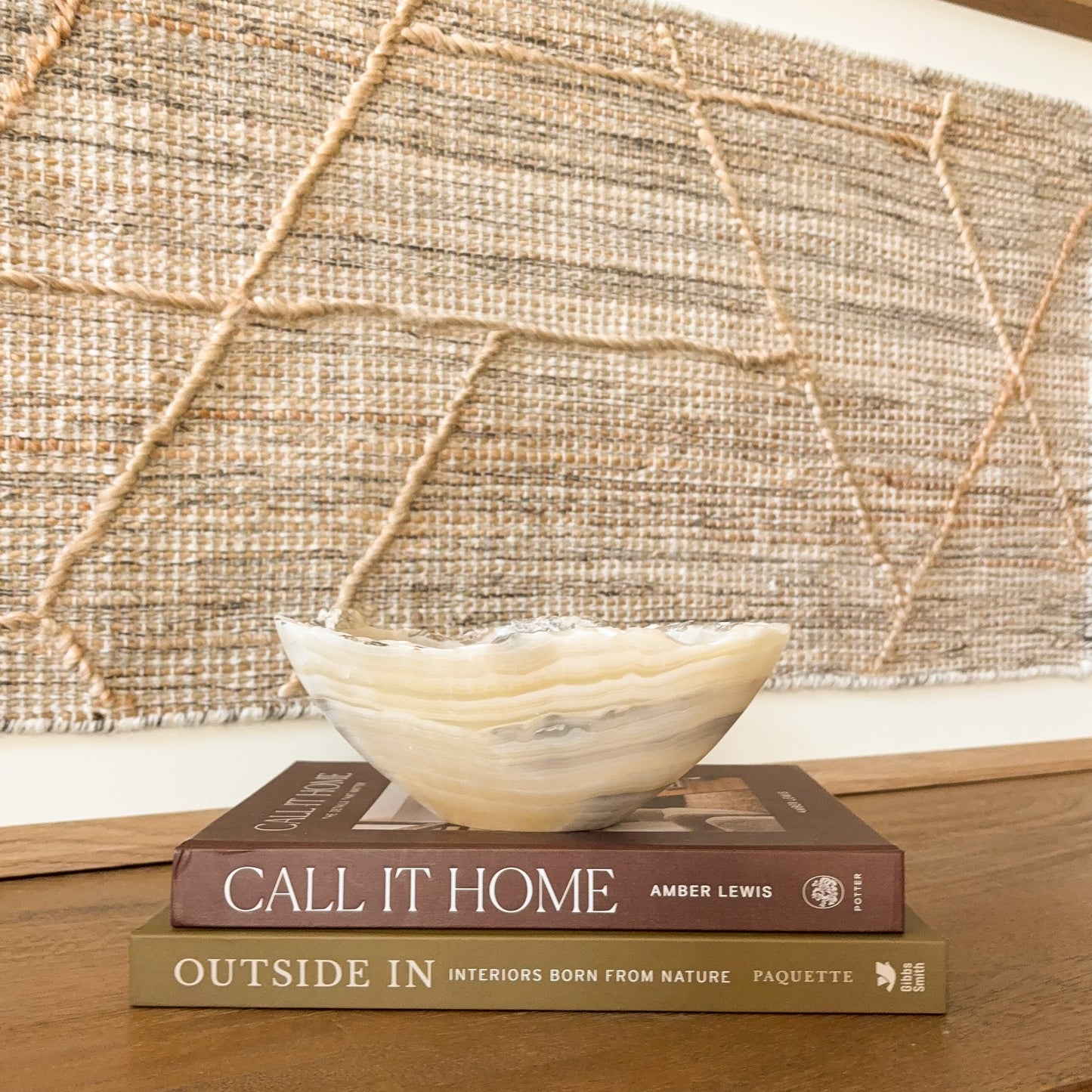 Hand carved amber onyx bowl featuring layered cream, gold, and gray banding, polished natural stone accent for modern home decor