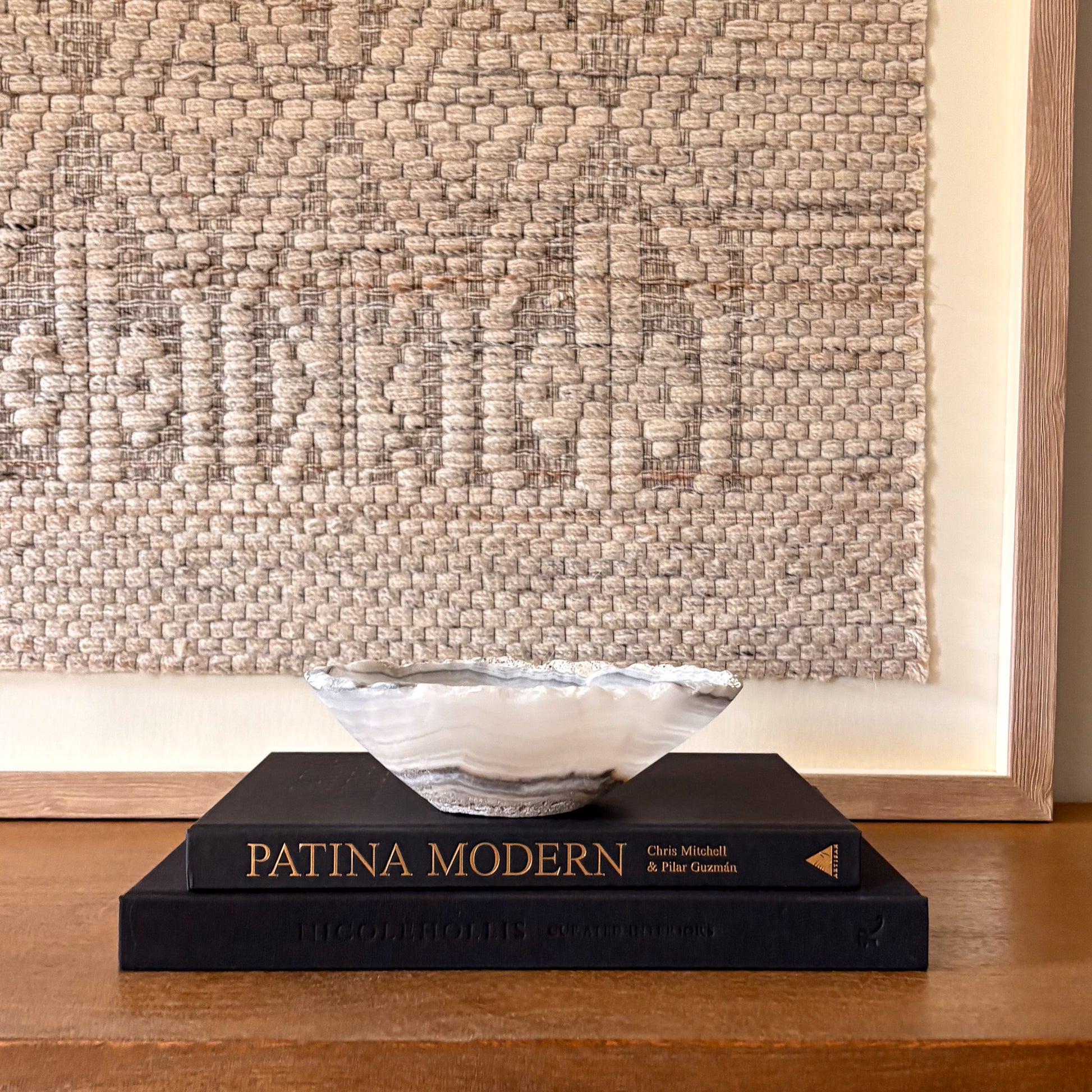 Small hand carved grey onyx bowl with natural stone patterns, decorative artisan stone dish