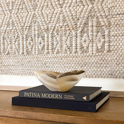 Artisan hand carved small grey onyx bowl featuring natural stone variations and smooth finish