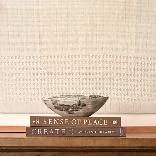 Sculptural grey onyx bowl showcasing unique veining and hand-carved craftsmanship.
