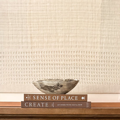 Decorative hand-carved grey onyx centerpiece bowl with natural stone variations.