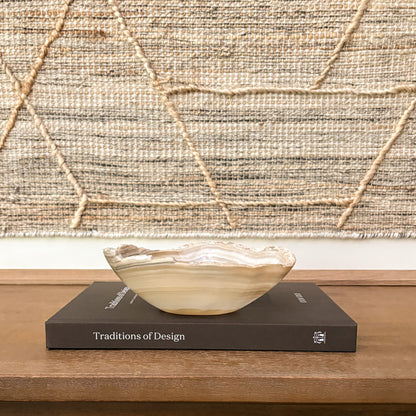 Genuine Grey Onyx catchall bowl styled on a coffee table
