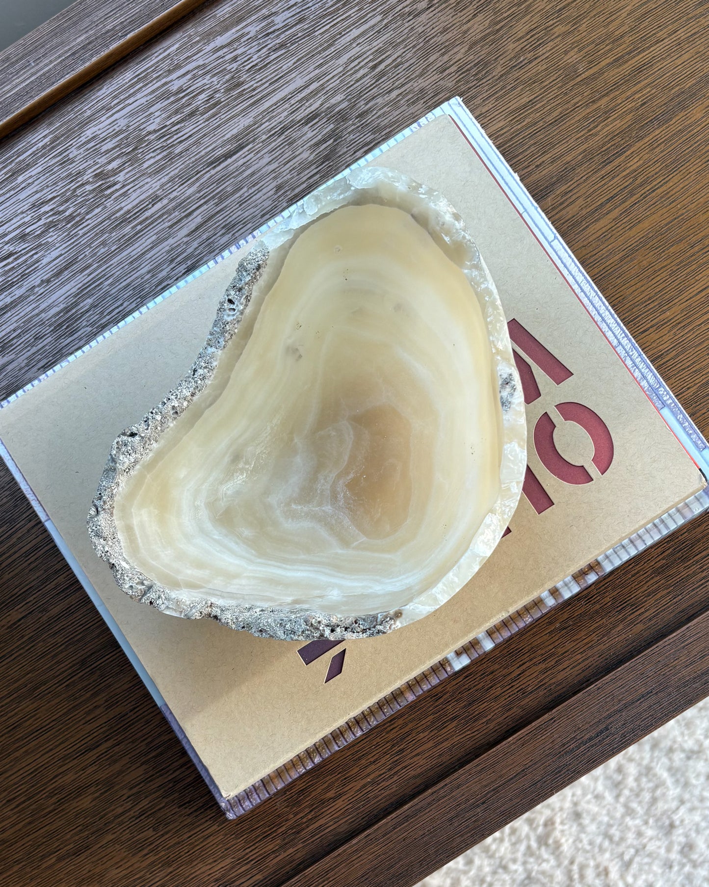 Polished grey onyx stone bowl with organic natural veining