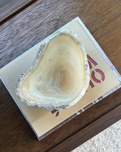 Polished grey onyx stone bowl with organic natural veining