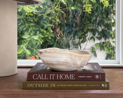 Hand-carved white onyx bowl with natural stone veining
