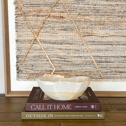 Hand carved small amber onyx stone bowl with natural translucent veining