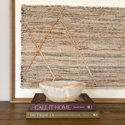 Hand carved amber onyx bowl used as minimalist home decor accent